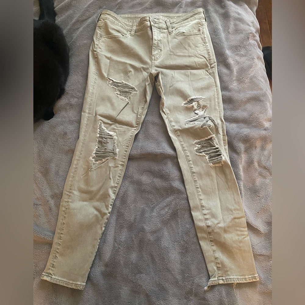american eagle super stretch green ripped jeans/jeggings size 14